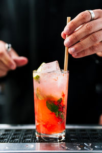 Midsection of man holding coffee