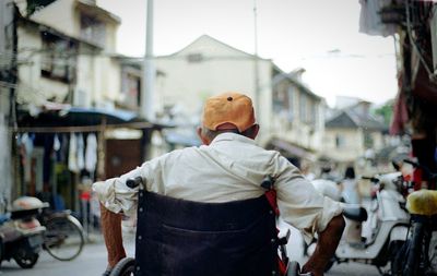 Rear view of man in market