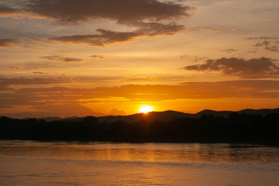 Scenic view of sea against romantic sky at sunset