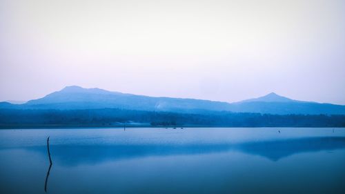 Scenic view of lake against mountain range