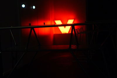 Empty chair in illuminated building