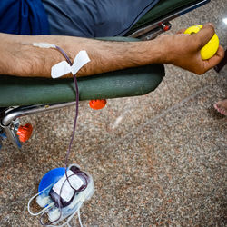Blood donor at blood donation camp held with a bouncy ball holding in hand at balaji temple