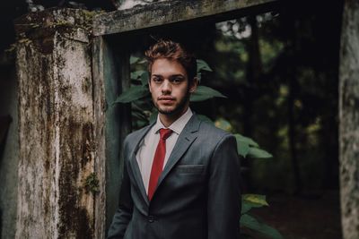 Portrait of young man standing outdoors