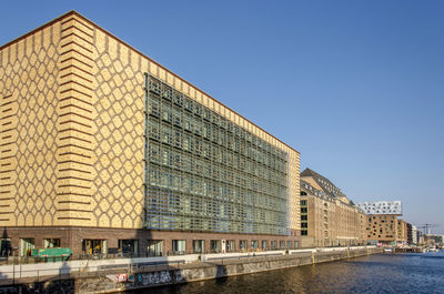View along the north bank of the river spree with a mixture of old and new buildings