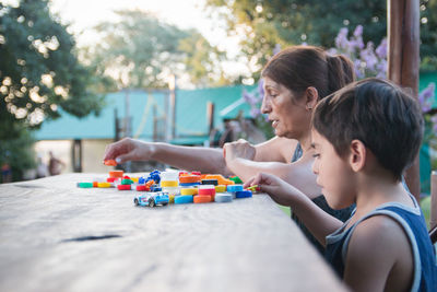 Portrait of boys playing on table