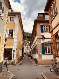 Street amidst buildings against sky
