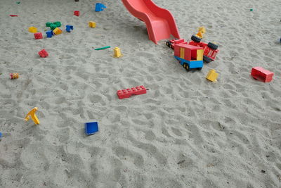 Toy playing on sand at beach