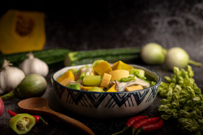 Close-up of fruits and vegetables on cutting board