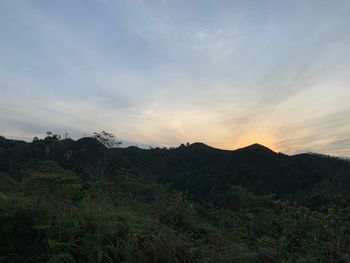 Scenic view of mountains against sky during sunset