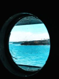 Scenic view of sea seen through window