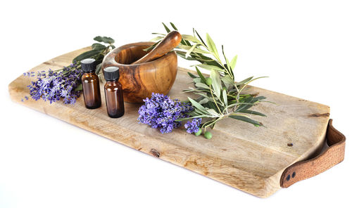 Spa equipment on cutting board over white background