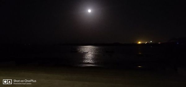 Scenic view of sea against sky at night