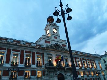 Low angle view of building against cloudy sky