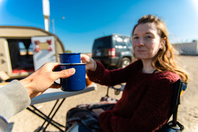 Close-up of woman holding coffee cup