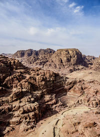 Rock formations on landscape against sky