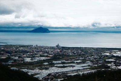 View of cityscape next to sea