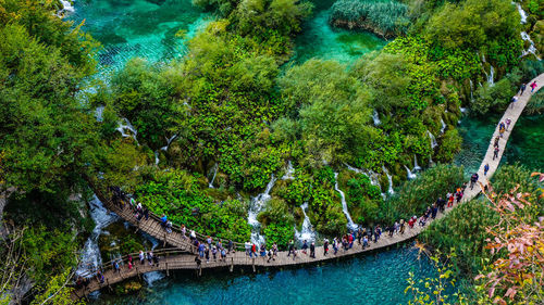 High angle view of people on bridge over river