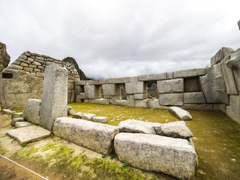 Old ruins of building against cloudy sky