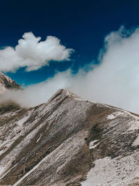 Low angle view of volcanic mountain against sky