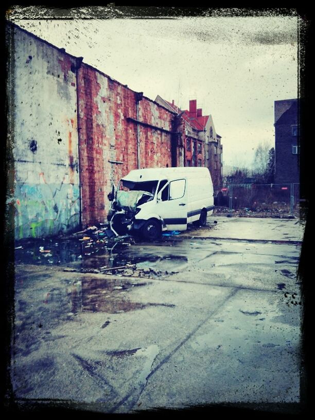 transfer print, building exterior, auto post production filter, transportation, architecture, built structure, land vehicle, car, mode of transport, street, road, sky, house, outdoors, day, abandoned, building, city, no people, sunlight