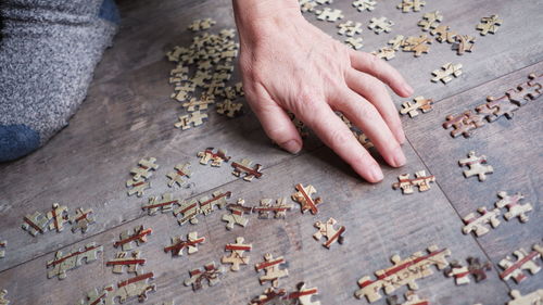 High angle view of hands on table