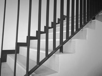 Shadow of railing on staircase in building