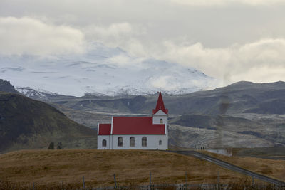 Church building near snowy mountain