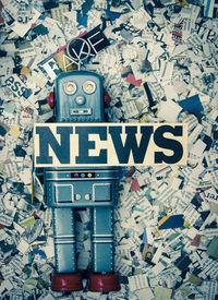 Close-up of text on paper against wall