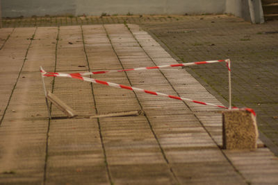 Cordon tape on footpath in city