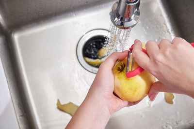 Midsection of man preparing food in kitchen at home