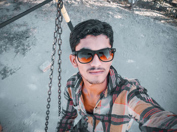 Portrait of young man wearing sunglasses