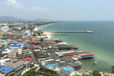 High angle view of sea and buildings against sky