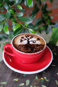 Close-up of cappuccino on table