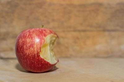 Close-up of eaten apple on table