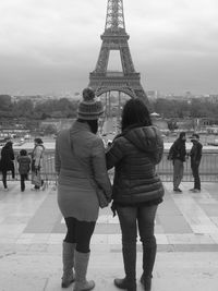 People standing in front of eiffel tower