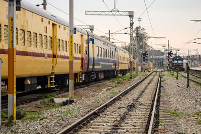 Indian railway train at amritsar railway station platform during morning time, colourful train