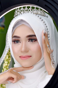 Portrait of young woman wearing hijab