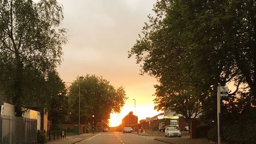 Cars on road at sunset