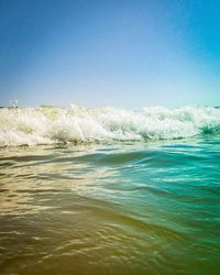 Scenic view of sea against clear blue sky