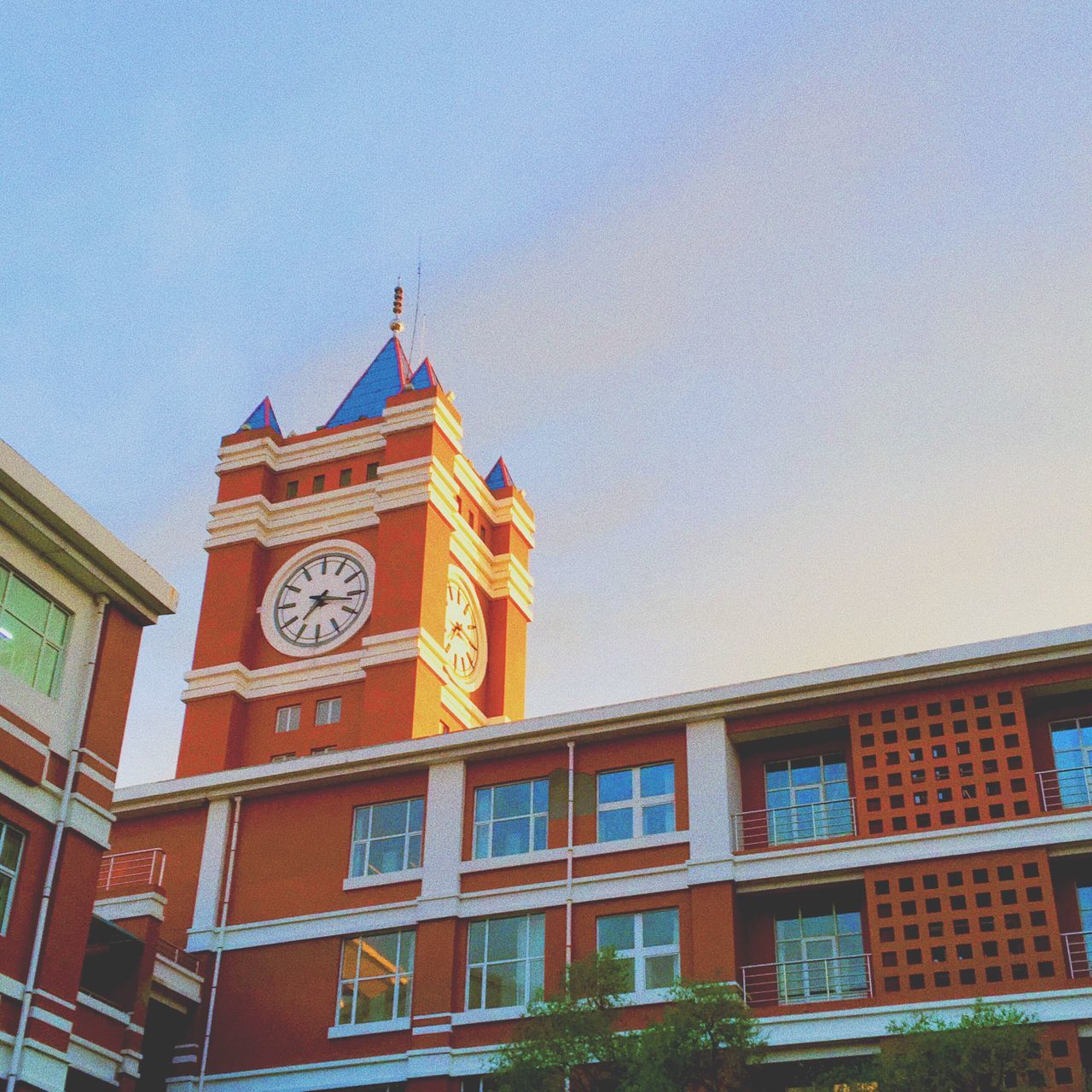 low angle view, architecture, building exterior, built structure, outdoors, day, no people, clock tower, sky, clock