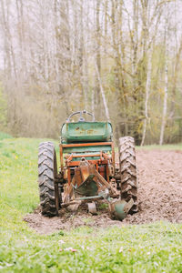 Abandoned tractor on field