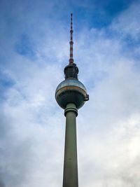 Low angle view of communications tower against sky