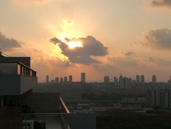 City lit up at sunset