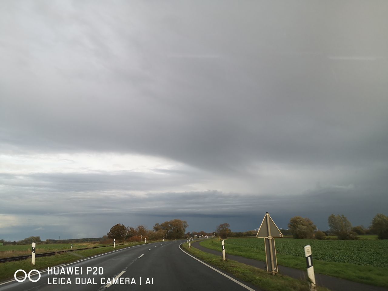 VIEW OF ROAD SIGN AGAINST SKY