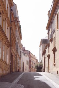 Street amidst buildings against sky