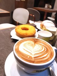 Close-up of cappuccino served on table