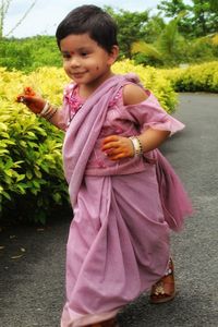 Cute girl holding plant