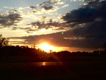 Scenic view of sunset over lake