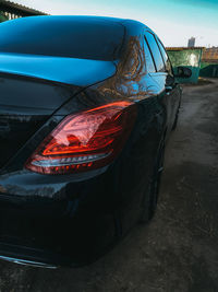 Close-up of damaged car parked on road