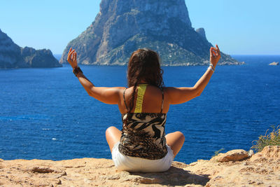 Rear view of woman looking at sea